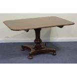 A 19th Century mahogany tip-top breakfast table, the rectangular top above a turned baluster stem