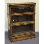 A George V oak Globe Wernicke three section glazed bookcase, fitted with a single drawer, height