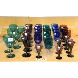 A set of six Bristol green wine glasses, early 20th Century, each with clear stem, five amethyst