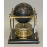 A Royal Geographical Society World clock, circa 1980, the black globe with gilt detail, within a