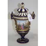 An English porcelain Sèvres style vase and cover, mid-19th Century, the urn shaped body painted with