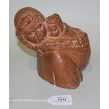 A Demetre Chiparus cast terracotta bust of a mother carrying a child on her back, cast signature,