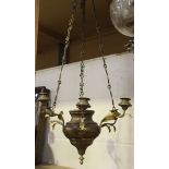 A late 19th/early 20th Century brass sanctuary ceiling light, fitted with six candle holders and