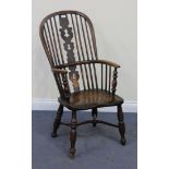 A 19th Century beech and elm Windsor armchair, with a stick and pierced splat back, the moulded seat