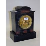 A late 19th Century American slate mantel clock with eight day movement striking on a gong, the