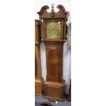 A George III oak longcase clock with thirty hour movement striking on a bell, the square brass