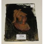 An early 19th Century painted carved wax head and shoulders profile portrait of a classical style