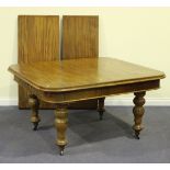 A mid-Victorian mahogany extending dining table, the moulded top fitted with two extra leaves,