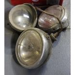 A collection of various car lamps, including a King of the Road No. 462 by Joseph Lucas Ltd.