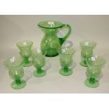 A green crackled glass lemonade set, 1940s, comprising a jug and six glasses.