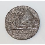 A cast iron medallion commemorating the sinking of the Lusitania, dated 5th May 1915.