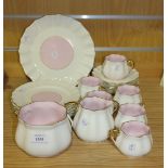 An E.J.D. Bodley porcelain pink and white part coffee service, 1875-1892, of lobed form with gilt