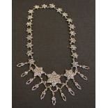 A 19th Century faceted steel collar necklace, the links formed as a series of graduated stars,