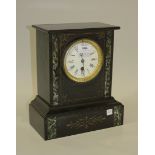 A Victorian slate mantel timepiece with eight day movement, the circular enamel dial with Roman
