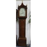 A George III oak longcase clock with a brass four pillar eight day movement striking on a bell,