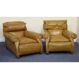 A pair of early/mid-20th Century club armchairs upholstered in tan leather, the scroll arms above