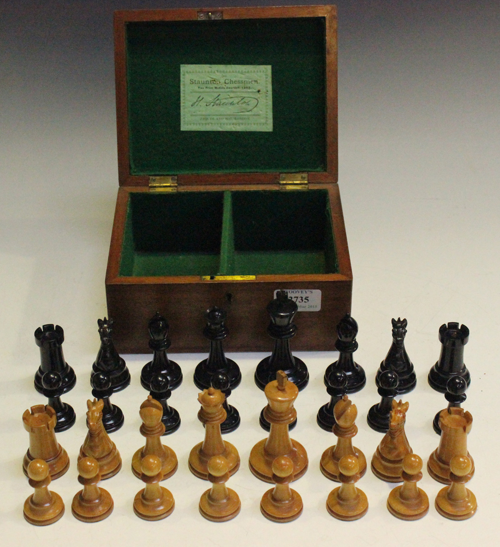 A late 19th/early 20th Century boxwood and ebony Staunton chess set by Jaques and Son, London, the