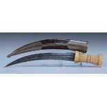 A Middle Eastern jambia with curved double edged blade with central spine, length approx 29cm,