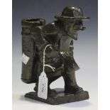 An early 20th Century brown and green patinated cast bronze figure of a standing bearded fisherman