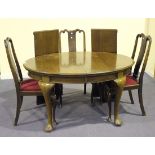 A George V mahogany 'D' end extending dining table, the moulded top with two extra leaves, on