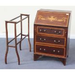 An Edwardian mahogany bureau, inlaid with urn and swags, the fall flap above three long drawers,