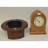 An early 20th Century American oak mantel clock with eight day movement striking on a gong, the