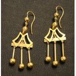 A pair of gold pendant earrings, the fronts with graduated spherical three row drops and the tops