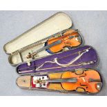 An early 20th Century violin, length of back excluding button 34.7cm, cased, with a bow, together