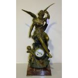 A late 19th Century French rouge marble and spelter mantel clock with eight day movement striking on