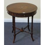 A late Victorian rosewood circular occasional table, the drum top fitted with drawers, on turned