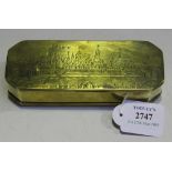 An 18th Century Dutch brass canted rectangular tobacco box, the hinged lid engraved with a titled