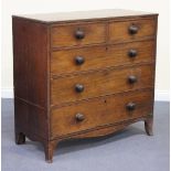 A George IV mahogany chest of two short and three long drawers with turned handles, on splayed