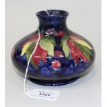 A Moorcroft pottery Leaf and Berry pattern vase, 1945-49, of compressed bulbous shape with blue