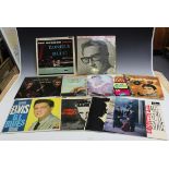 A small collection of LP records, including 'Singin' To My Baby' by Eddie Cochran and albums by