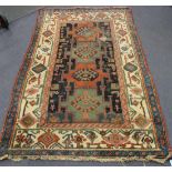 A Hamadan rug, North-west Persia, early 20th Century, the blue field with four medallions, within an