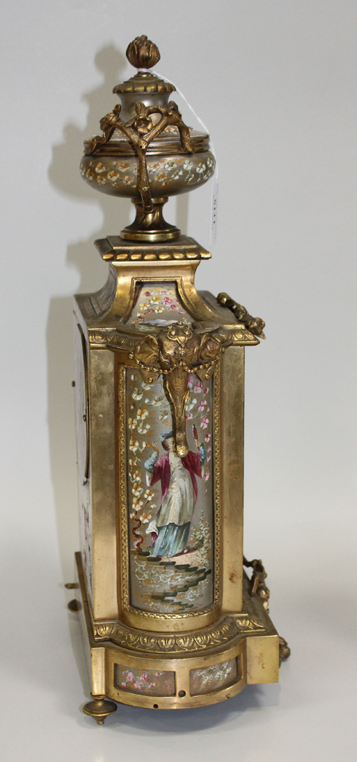 A late 19th Century French ormolu and silvered porcelain mantel clock garniture, the clock with - Image 2 of 3