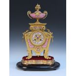 A late 19th Century French ormolu and Sèvres style porcelain mantel clock with eight day movement