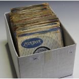 A collection of 7" records, including singles by Eddie Cochran, Jerry Lee Lewis, Buddy Holly,