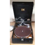 An HMV black leatherette cased portable gramophone, width approx 41cm, and a small collection of