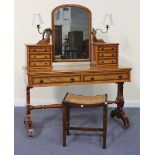 A late Victorian stained pine dressing table with simulated burrwood and crossbanded borders, the