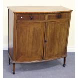 An Edwardian mahogany bowfront cabinet, crossbanded in satinwood, fitted with two drawers above