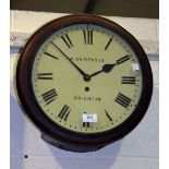 An early 20th Century mahogany cased circular wall timepiece with fusee movement, the painted dial