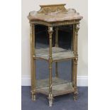 A mid-19th Century Neoclassical Revival giltwood and gesso three-tier pier table, the shaped