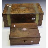 A late Victorian burr walnut and brass bound writing slope, the hinged lid revealing a fitted