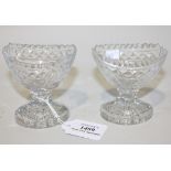 A pair of Irish cut glass boat shaped salts, early 19th Century, with notched rims raised on