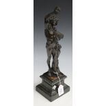 After the antique - a late 19th Century dark brown patinated cast bronze figure of Bacchus holding a