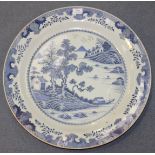 A large Chinese blue and white export porcelain circular dish, Qianlong period, the centre painted