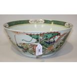 A Chinese famille verte porcelain punch bowl, 19th Century, the exterior painted with a frieze of