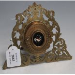 A mid-Victorian pierced and engraved brass miniature double portrait frame, the hinged oval cover