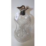 A Victorian silver mounted and cut glass 'cluck-cluck' decanter, Sheffield 1891 by Atkin Bros,